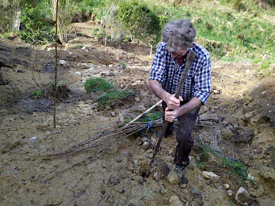 Picture of Ian making a hole with a crowbar