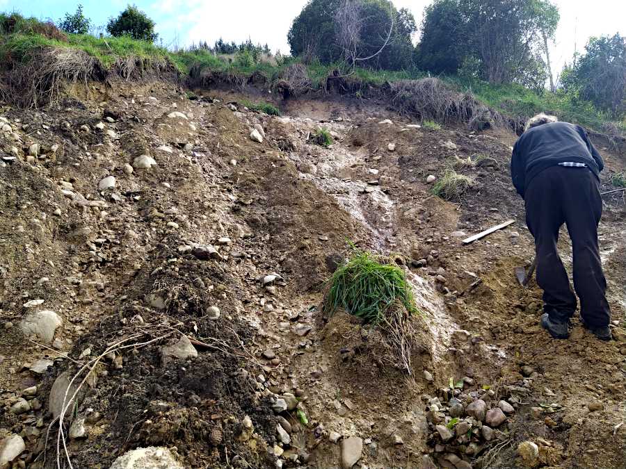 Picture of Ian making a path across the bottom of the slip