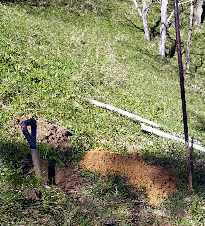 Poplar hole dug in field above slip