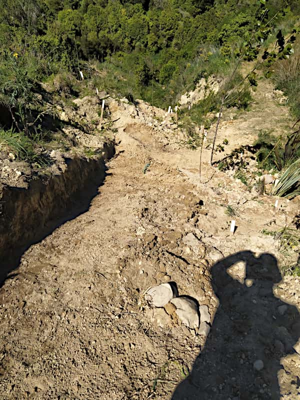 Looking down a steep newly made track